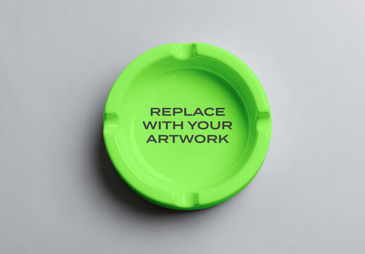 Circular ashtray mockup viewed from above on a neutral gray surface, flat lay presentation for graphic design, branding, print, advertising, and product display