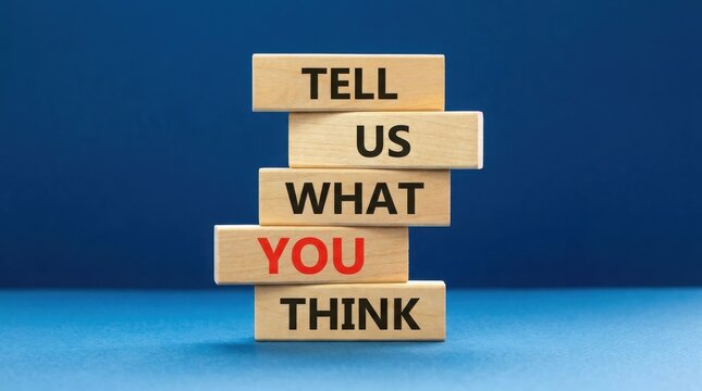 Wooden blocks stacked with text tell us what you think