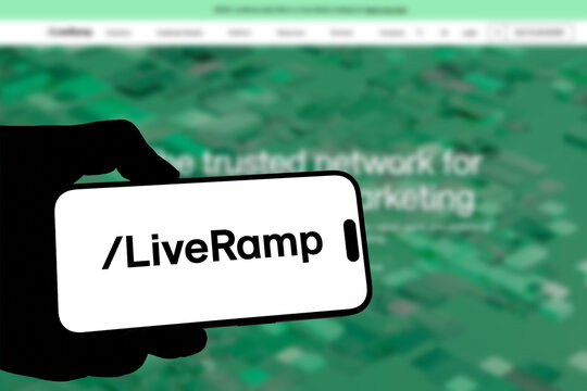 Kiel, Germany - 08-19-2026: Smartphone displaying US data collaboration software company LiveRamp logo in front of companys webpage