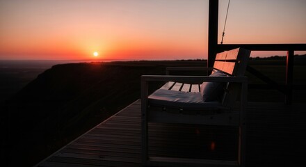 Fototapeta premium Tranquil Evening Vista From A Wooden Deck Chair