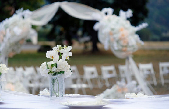 Table decoration and flowers at an outdoor wedding