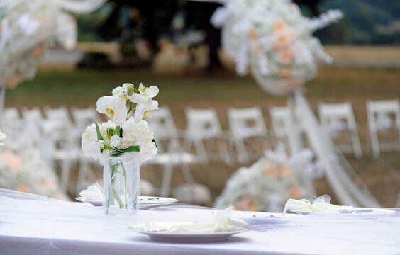 Table decoration and flowers at an outdoor wedding