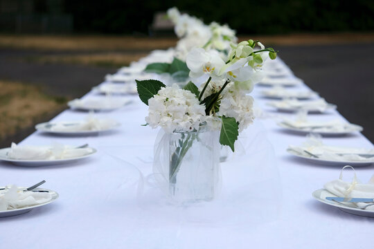 Table decoration and flowers at an outdoor wedding