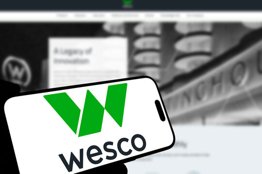 Kiel, Germany - 08-19-2026: Smartphone displaying US electrical distribution and supply chain company Wesco logo in front of companys webpage