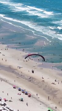 Parasail In Fortaleza Ceara Brazil. Tourists Parasailing Over A Tropical Ocean On A Sunny Day. Seaside Beach. Tropical Skyline. Fortaleza Ceara.