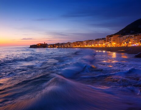 coastal scene at dusk gentle waves city lights atmospheric evening
