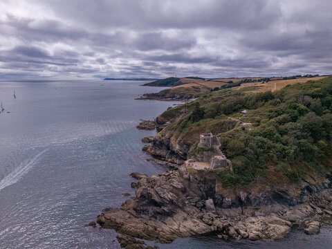 Aerial view of St Catherines Castle on a rocky coastline in Fowey, England