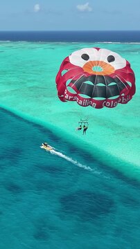 Parasailing In San Andres Caribbean Island Colombia. Thrilling Adventure With Speedboat Paragliding In Turquoise Ocean. Summer Backgrounds. Bay Water Landscape. San Andres Caribbean Island.