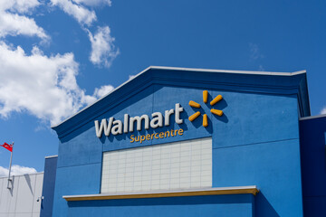 Fototapeta premium Toronto, ON, Canada - August 17, 2026: Closeup of the Walmart Supercentre retail store on the exterior blue facade. Toronto, ON, Canada. 