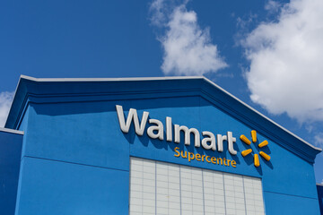 Fototapeta premium Toronto, ON, Canada - August 17, 2026: Closeup of the Walmart Supercentre retail store on the exterior blue facade. Toronto, ON, Canada. 