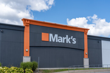 Fototapeta premium Toronto, ON, Canada - August 17, 2026: Mark's store sign on the building in Toronto, ON, Canada. Mark's ((formerly known as Mark's Work Wearhouse) is a Canadian clothing and footwear retailer. 