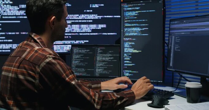Software engineer tests a mobile build, inspects crash reports and network calls, and pushes fixes to production from a sleek corporate desk.