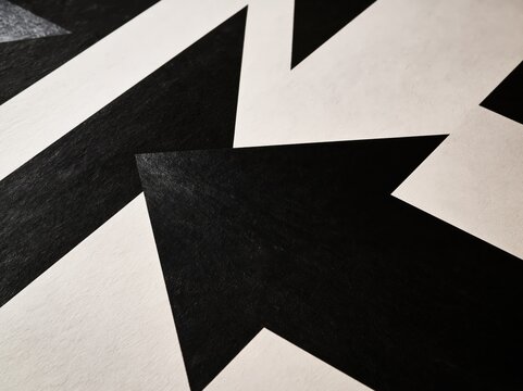 Close up of abstract black and white geometric arrow pattern