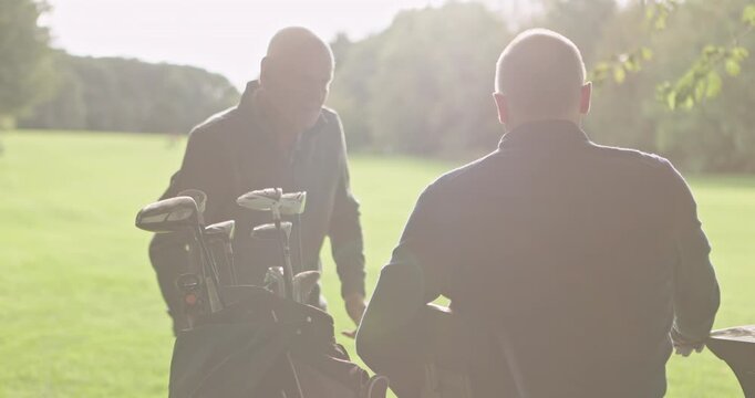 Elderly friends, golf course and man in wheelchair to play game, training and competition for recreation. Sports, golfer and person with disability with golfing club, ball and learning for fun hobby
