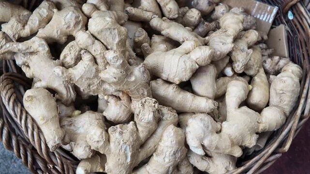 Fresh ginger root displayed in basket in Market
