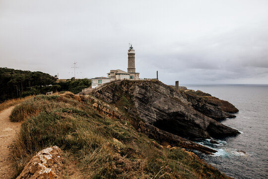 Cabo Mayor Lighthouse standing on dramatic coastal cliffs in Santander, Spain