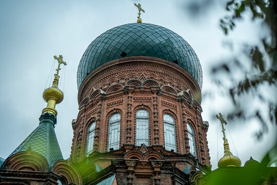 Illuminated green onion dome of Saint Sophia Cathedral at night in Harbin Heilongjiang China