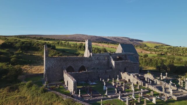 Corcomroe Abbey Ruins and Cemetery Against the Burren Hills in Ireland