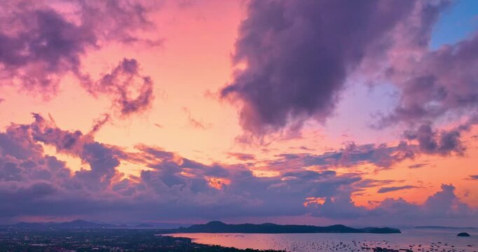 aerial view The purple clouds obscured the bright orange clouds that drifted slowly.
Clouds Forming in stunning sunrise.
The sky was dark, and in the distance, the clouds began to spin together,