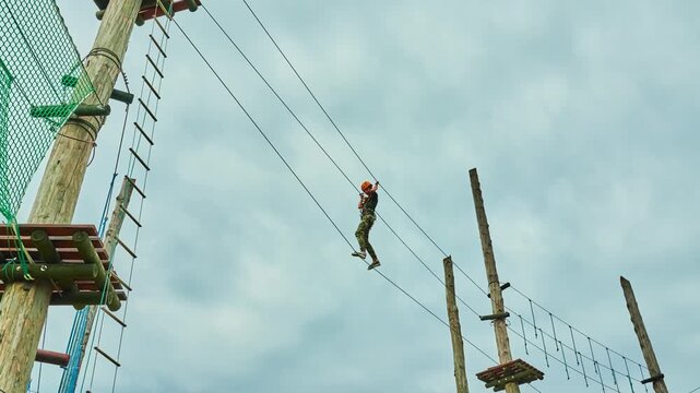 Girl climbing in adventure park