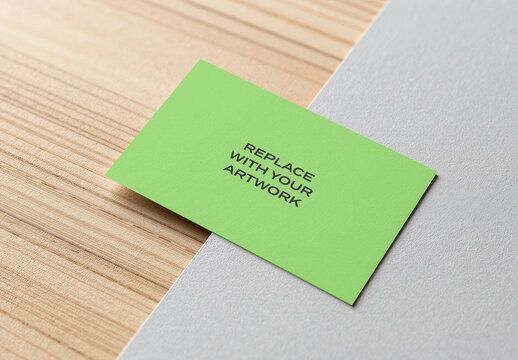 Business card mockup on a wooden surface with textured white paper, flat lay stationery presentation, realistic branding template for graphic design and print display