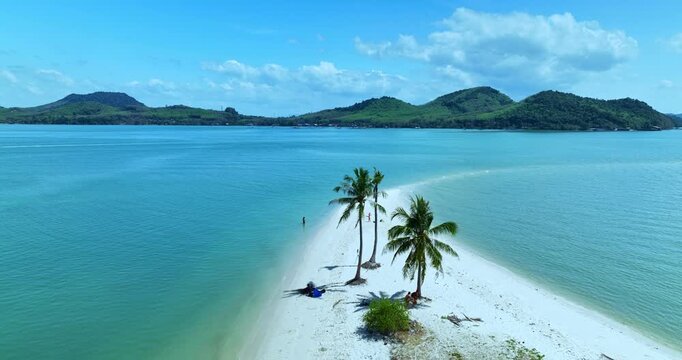 Aerial view of Laem Haad Beach&rsquo;s iconic sandbar on Koh Yao Yai, Phang Nga. White sand stretches into turquoise water at low tide as visitors walk along the narrow strip in a tropical paradise.