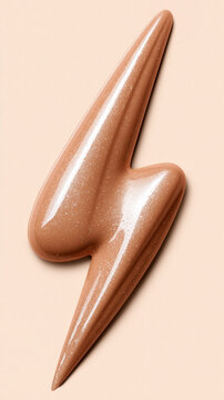 Shimmering bronze cosmetic gel swirled into bold lightning bolt shape, glossy metallic texture, macro detail on soft pastel background for beauty and skincare advertising.