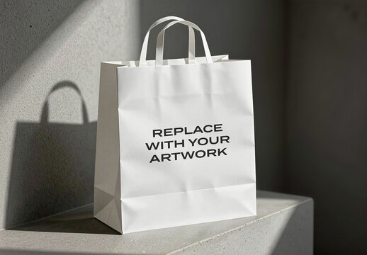 Paper shopping bag mockup on a concrete surface with natural shadow, minimalist packaging presentation, retail design template, commercial product display, branding placeholder artwork