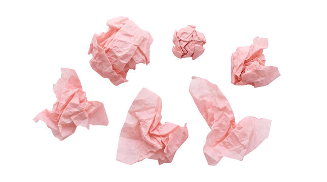 Crumpled pink paper balls on white background. Set of six crushed tissue paper scraps. Textured waste paper collection for creative design.