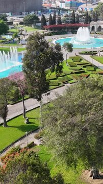 Parque De La Reserva In Lima Capital City Peru. Aerial View Of Green Space Surrounded By Lush Forest Trees. District Skyline. Urban Backgrounds. Lima capital city.