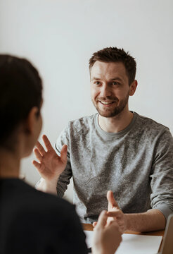 Business communication and collaboration, man talking and gesturing during a meeting or interview with a colleague