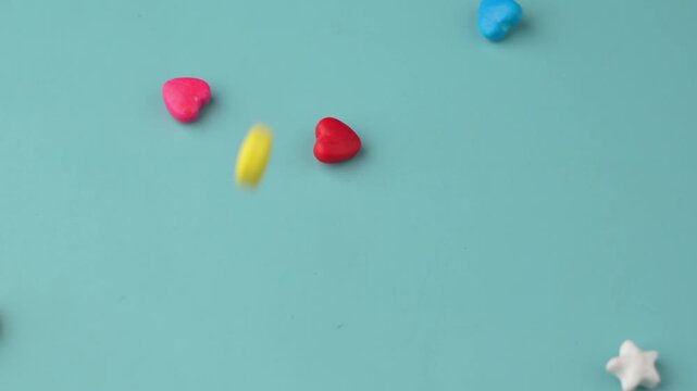 Colorful Candy Falling on Blue Background.