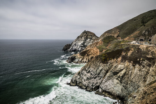 Gray Whale Cove State Beach coastal view with cliffs, ocean, and winding Cabrillo Highway.