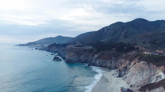 Aerial Bixby Bridge (Rocky Creek Bridge) and Pacific Coast Highway near Big Sur in California, USA America. Drone Shot