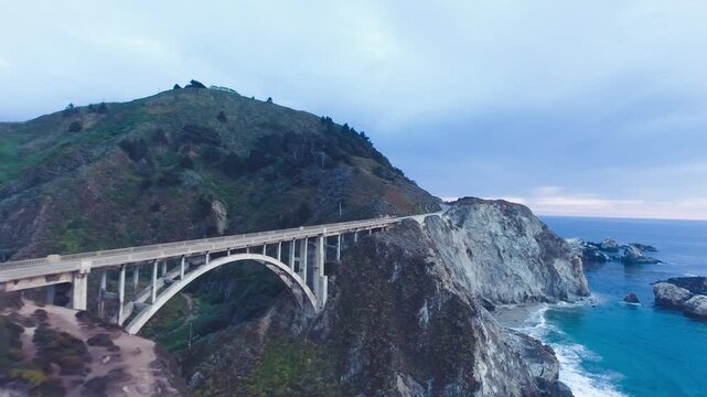 Aerial Bixby Bridge (Rocky Creek Bridge) and Pacific Coast Highway near Big Sur in California, USA America. Drone Shot
