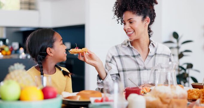 Mother, kid or lunch with food at table, for dessert or diet with happiness in family home together. Feeding daughter, parent or girl child with mom eating waffles, snack or meal for dinner for care