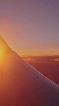 Glorious orange and pink hues at sunset from airplane