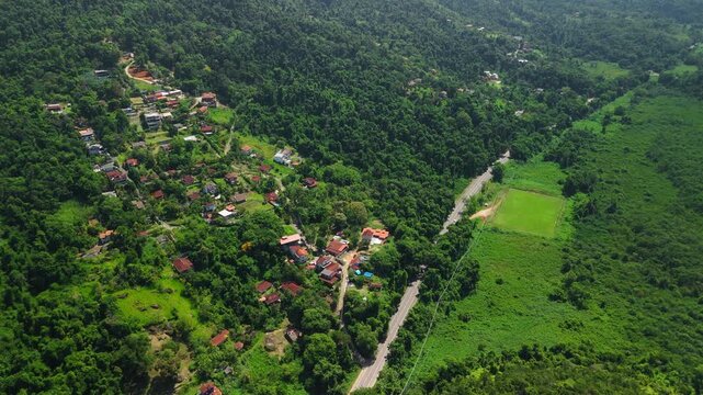 Aerial view of the living buildings surrounded by green forest. Area near the town of Paraty in Brazil