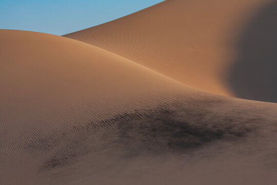Beautiful abstract sand dunes texture with dark mineral sand ripples