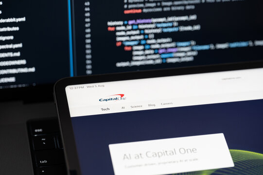 Capital One Ai company web page on program code background