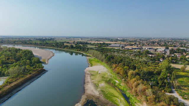 Po River in Lombardy and Emilia Romagna showing severe water depletion and exposed riverbed from a 2026 heatwave and prolonged drought, illustrating environmental challenges