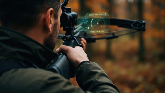 A hunter aiming a crossbow in a forest with a digital heads-up display showing wind speed, atmospheric pressure, and navigational data overlay