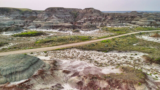 Cinematic drone view of Dinosaur Provincial Park canyon and prairie surroundings