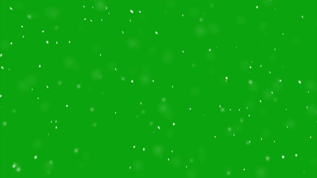 White particle dust and snow floating gently across a bright green screen, snowfall overlay, slowly falling snow effect, realistic snowfall, looping snowflakes, heavy snowfall overlay.