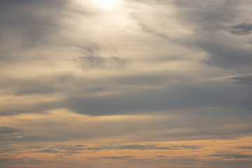 Obraz premium A dramatic sky with layers of dark clouds and a burst of bright sunlight, creating