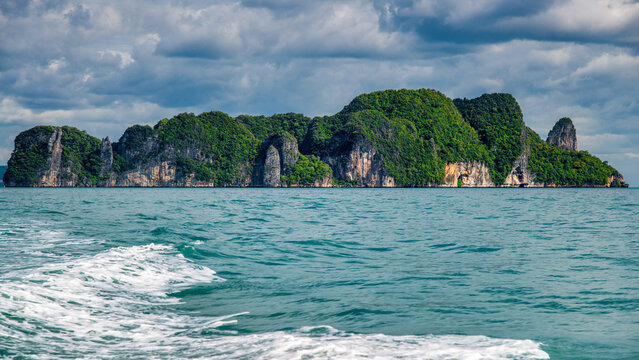 Pristine Ko Lao Bile Beach in Thailand with crystal-clear waters and untouched nature