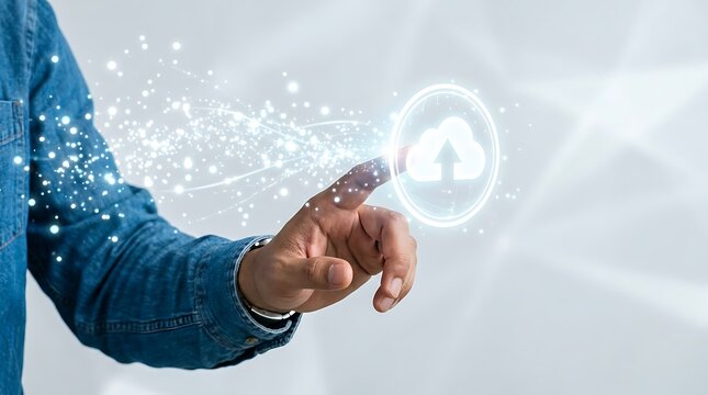 Man in denim shirt touching luminous cloud computing icon with flowing stardust particles represents data backup and secure server storage solutions in modern digital environment.