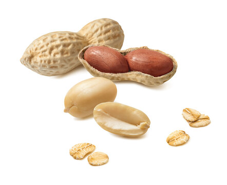 Peanuts and oat flakes isolated on white background. Real photography.