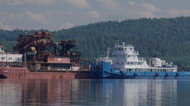 Sand producing machine work on the Kama river in Russia