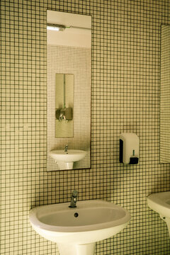 Bathroom With Tiled Walls and Sinks for Public Use